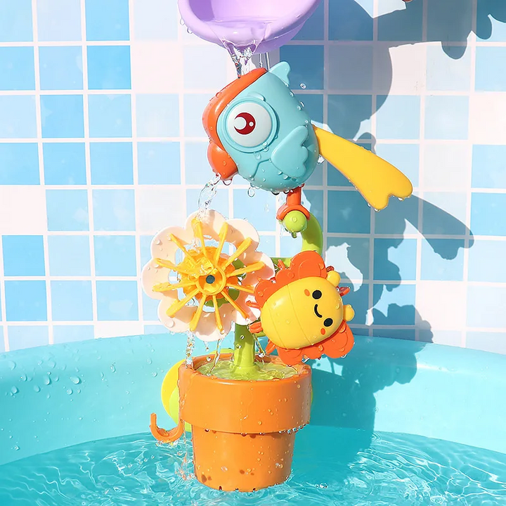 Bird bath toy with flower wheels and an orange bucket during water play