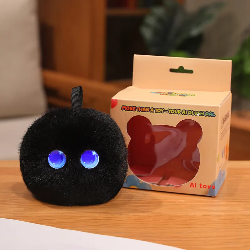 Black round AI plush toy with blue eyes and a top loop beside its box