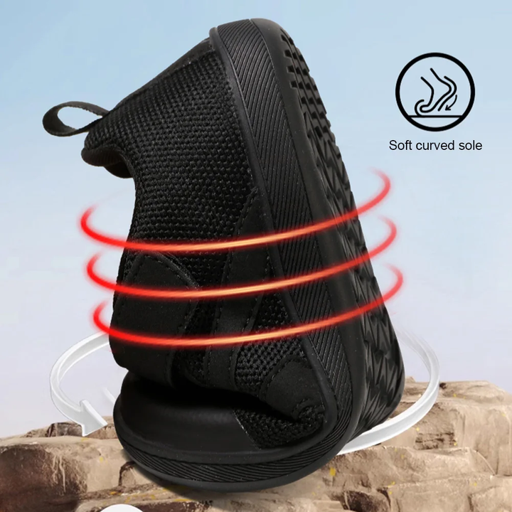 Black barefoot sneaker bent to show sole flexibility