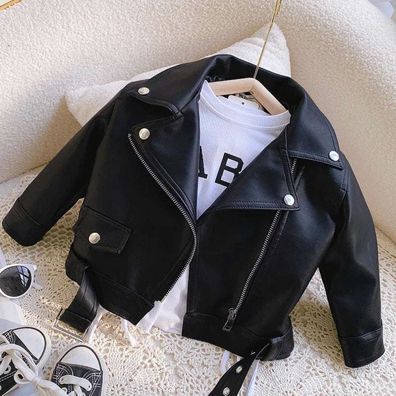 Black faux leather biker jacket styled over a white shirt