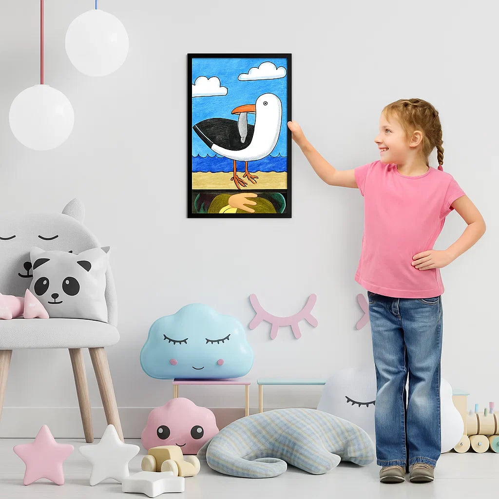 Child beside a black frame displaying a bird drawing in a playroom