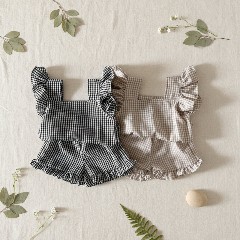 Black and Coffee gingham ruffle tops with matching bloomers arranged side by side