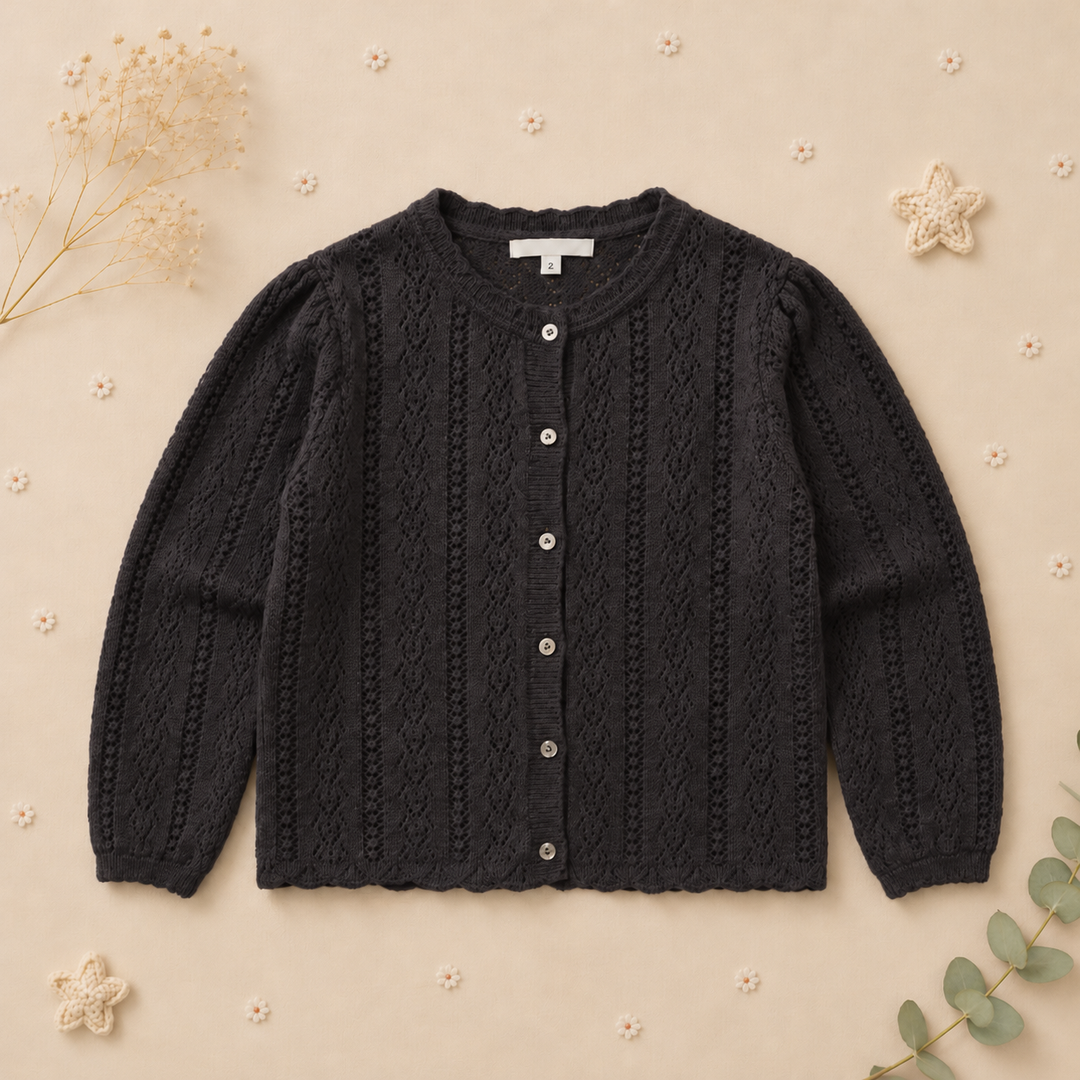 Front of the black cotton cardigan with round neckline and button closure
