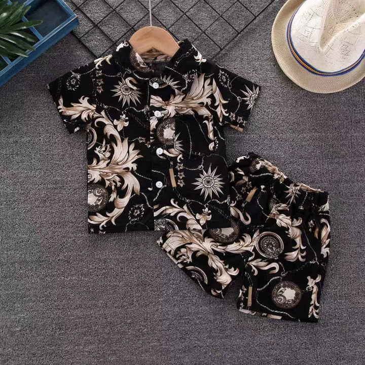 Black short-sleeve shirt and matching shorts with cream sun and scroll motifs