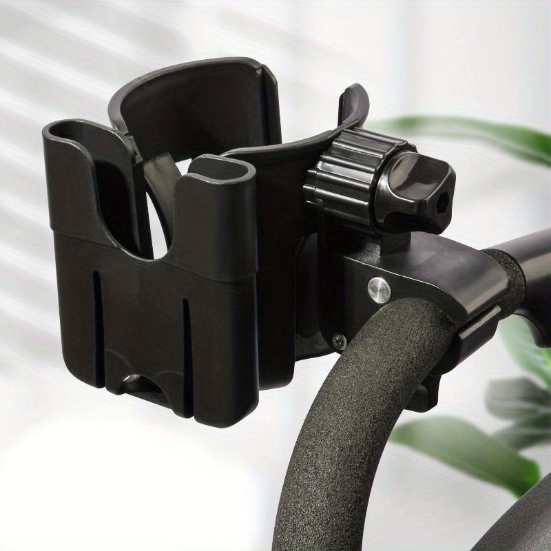 Black cup and phone holder mounted on a padded stroller handle.