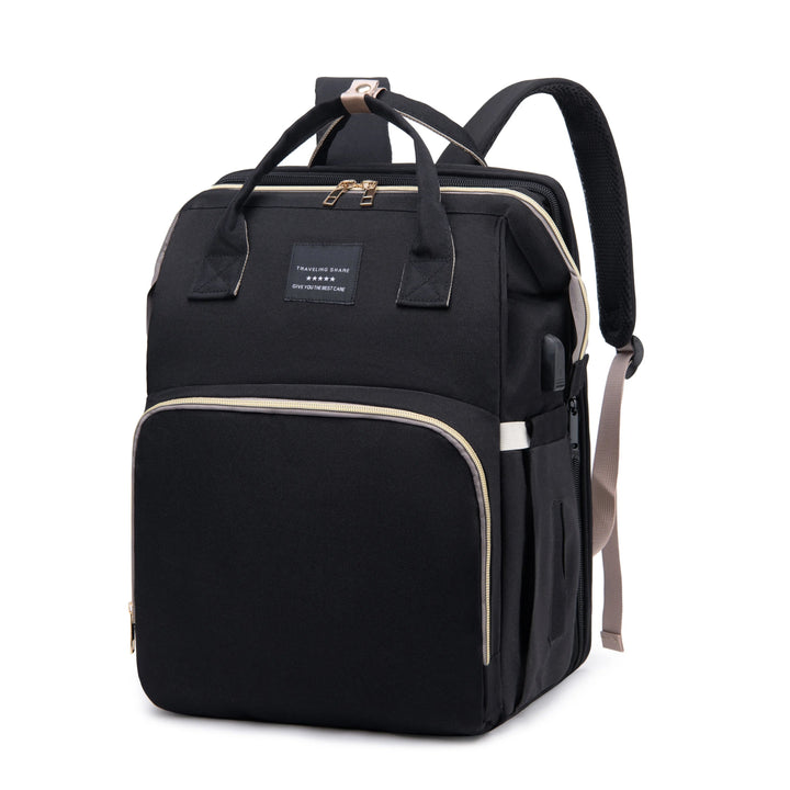 Black diaper backpack with top handles, shoulder straps, and a large front pocket.