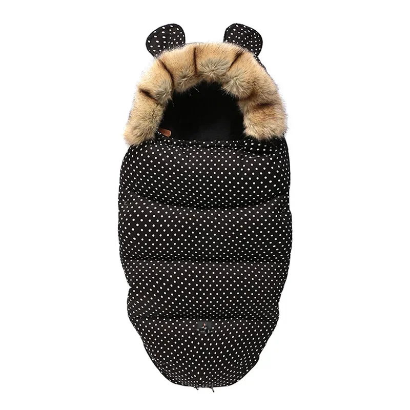Black stroller footmuff with fine white dots, faux fur trim, and matching ears