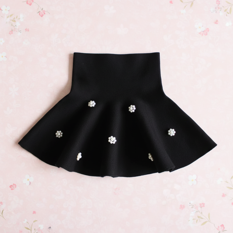 Black flared knit skirt with floral bead clusters