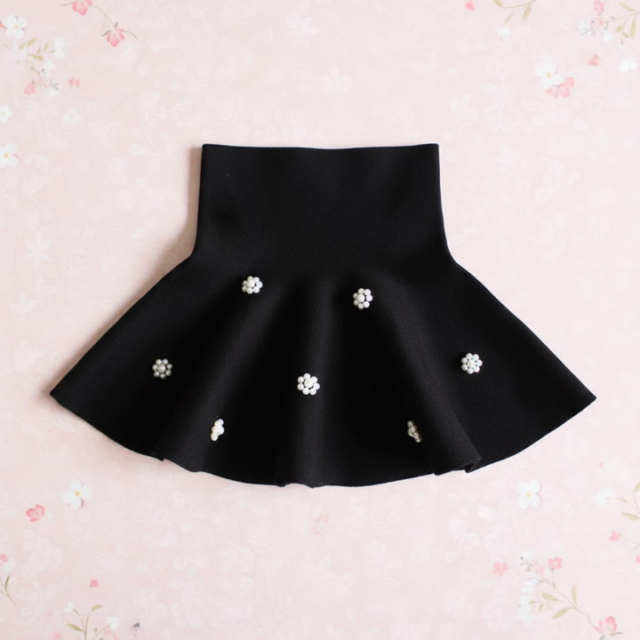 Black flared knit skirt with floral bead clusters