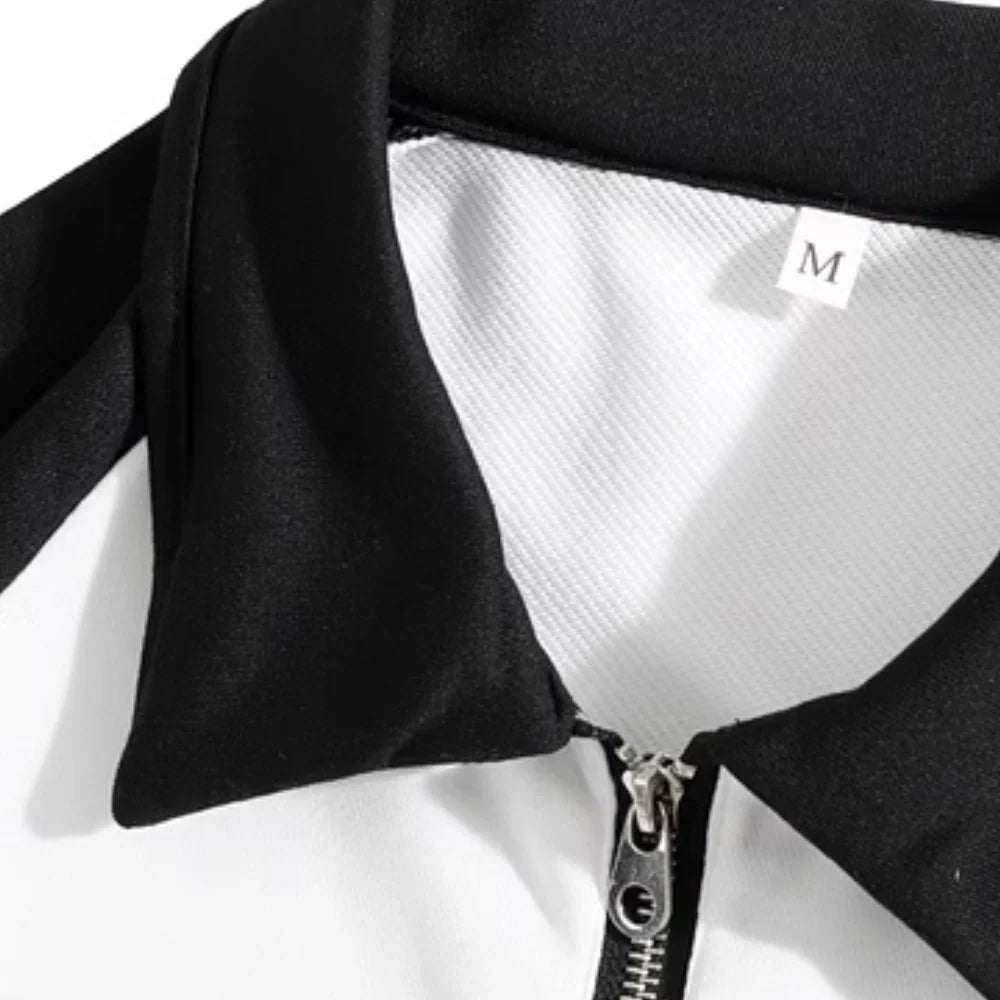 Close-up of the black collar and short zipper on the white sweater.