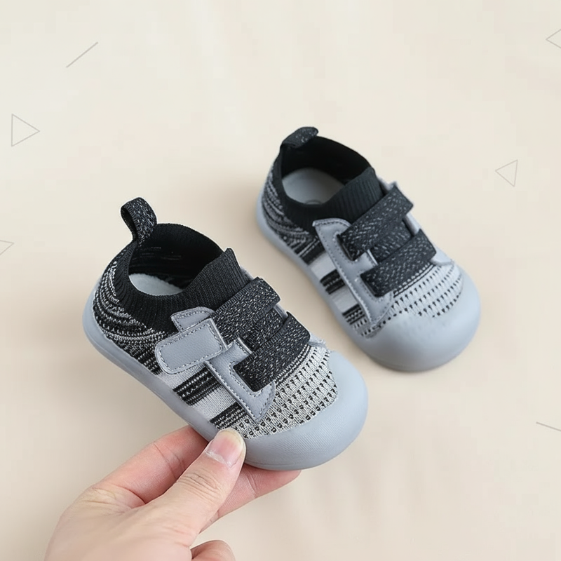 Black-gray baby shoes with mesh uppers, double straps, and heel pull tabs