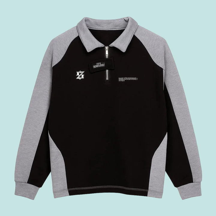 Front view of the black quarter-zip sweater with gray sleeves and a gray collar.