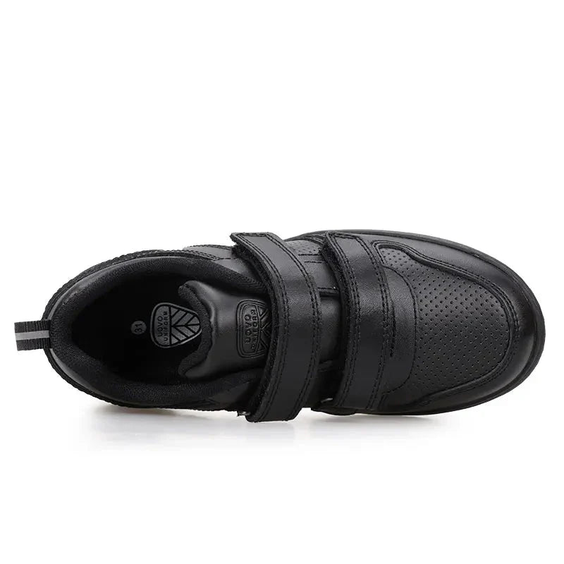 Top view of a black sneaker with two straps and a perforated toe panel