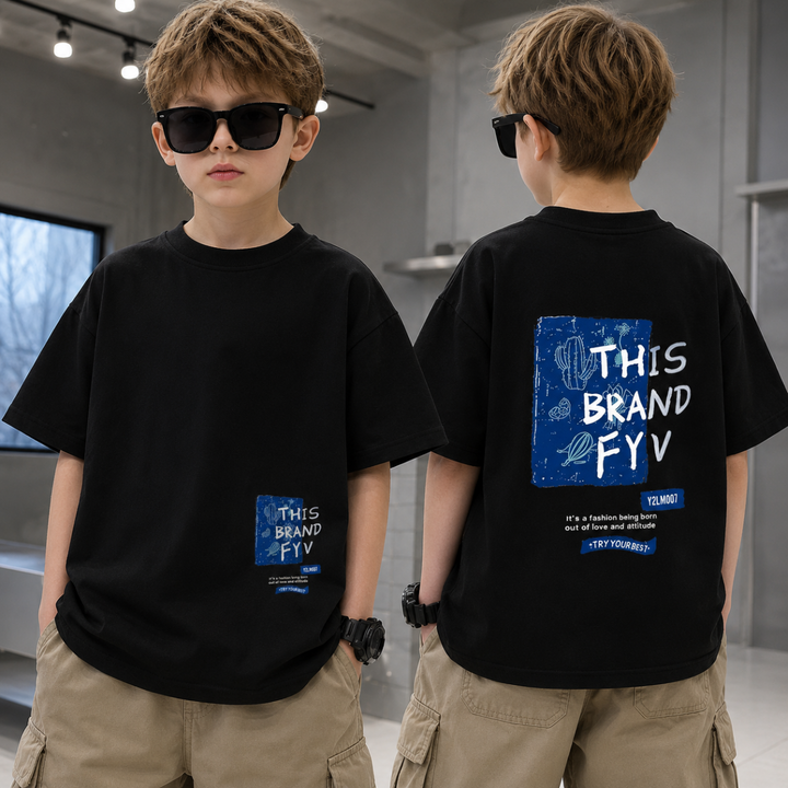 Front and back views of a boy wearing the loose-fit black graphic T-shirt.