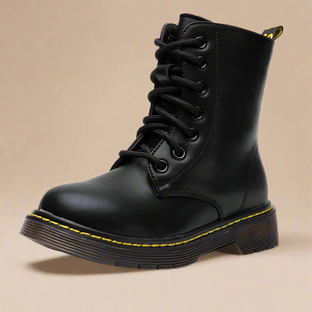 Black mid-calf combat boot with front laces and a textured rubber sole