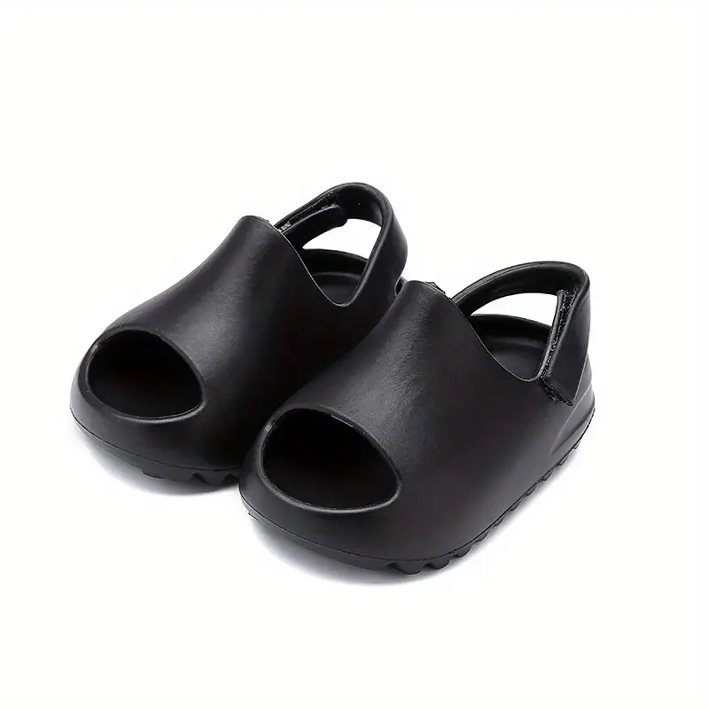 Pair of black EVA foam sandals with open toes and heel straps.