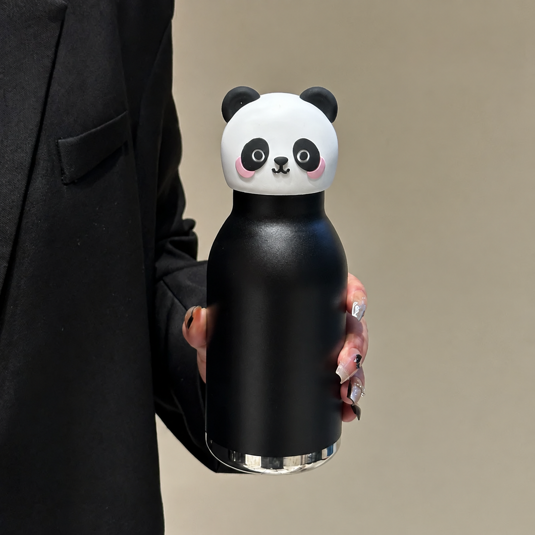 Black panda thermos bottle with a panda-face cap, held in one hand