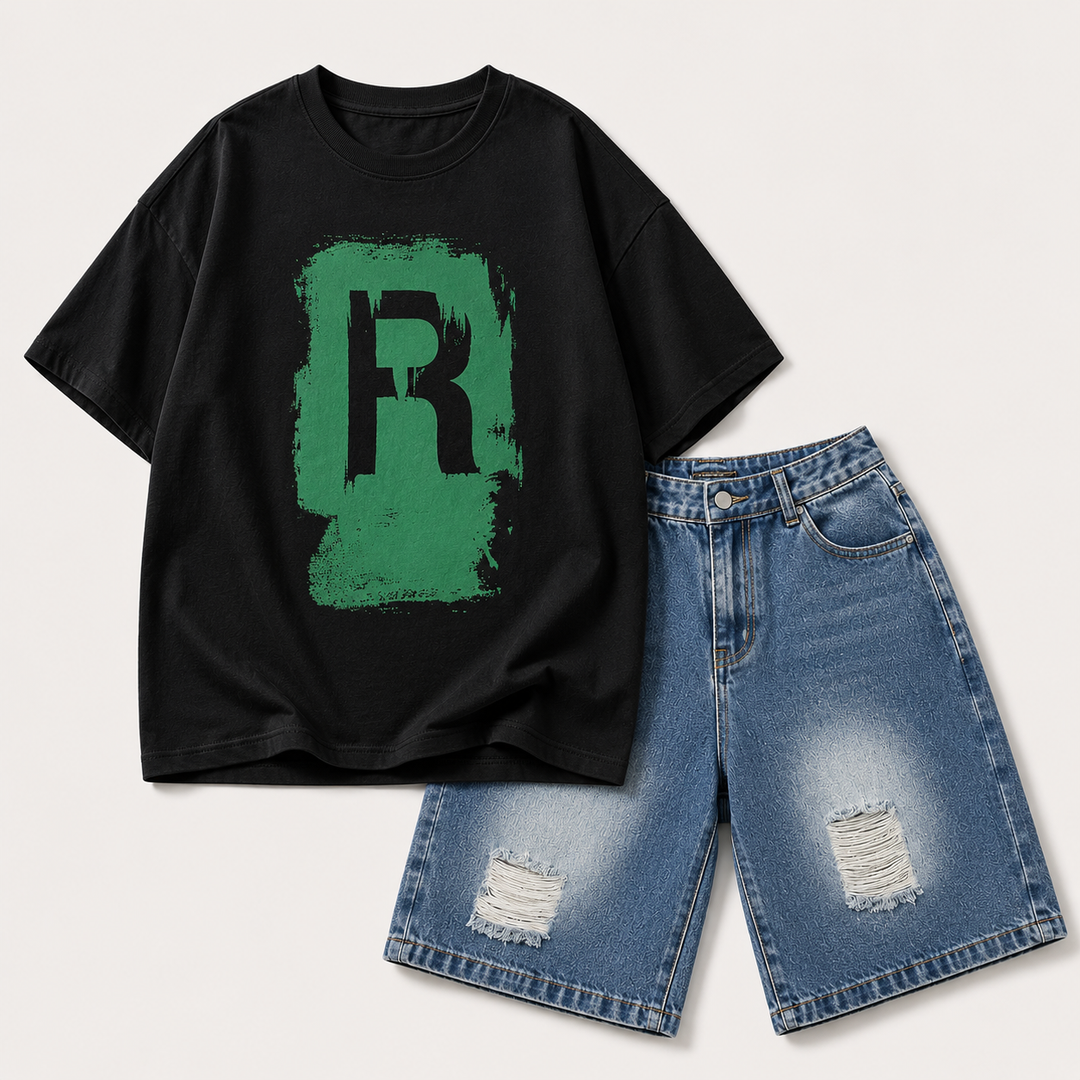 Black T-shirt with a green R graphic alongside blue distressed denim shorts.
