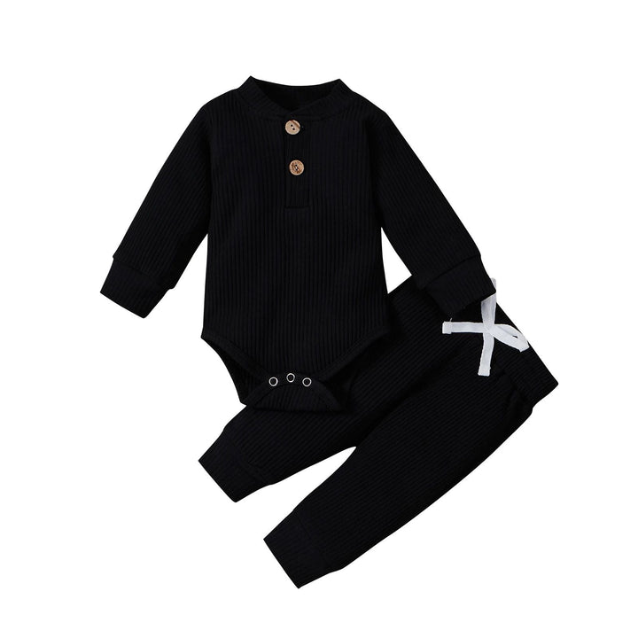 Black ribbed baby bodysuit and matching pants with a white waist tie