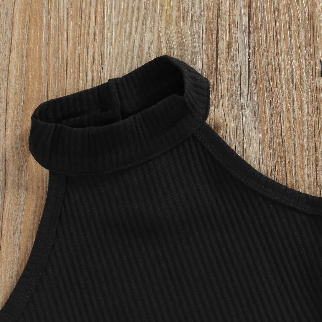 Close-up of the raised neckline and ribbed texture of the black sleeveless top.
