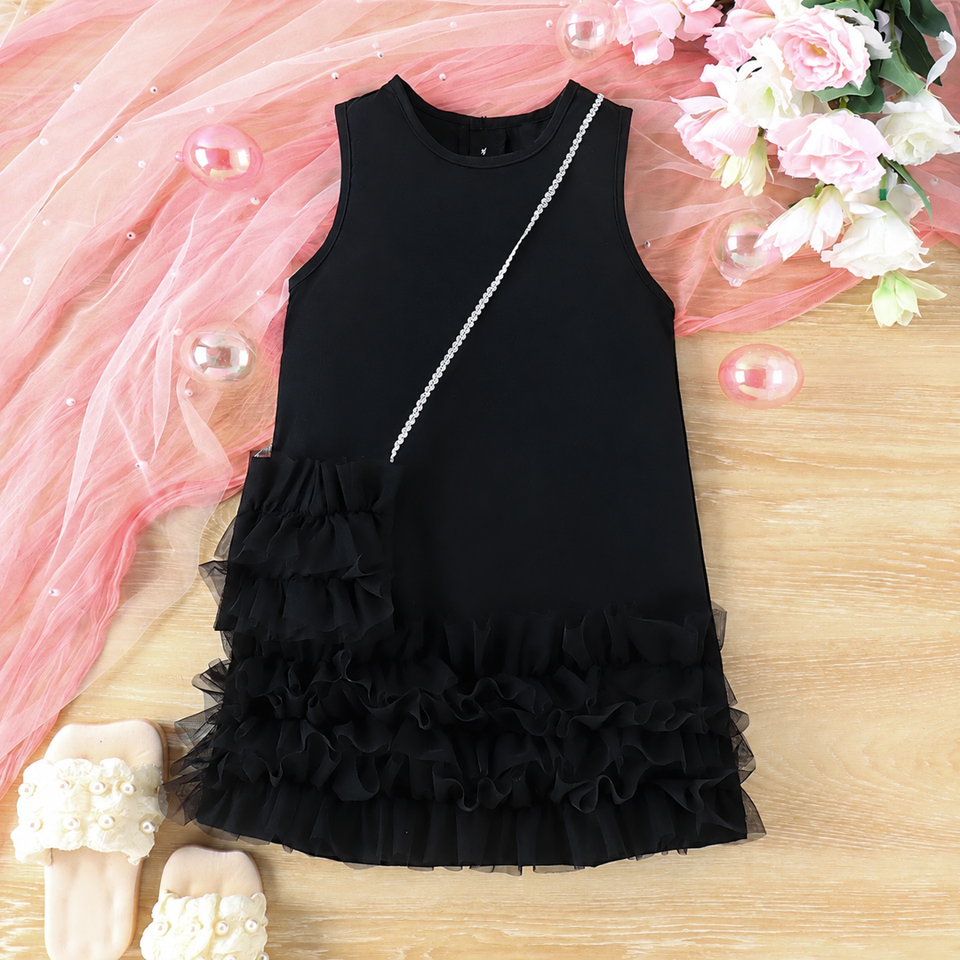 Black sleeveless dress with a ruffled hem and coordinating shoulder bag