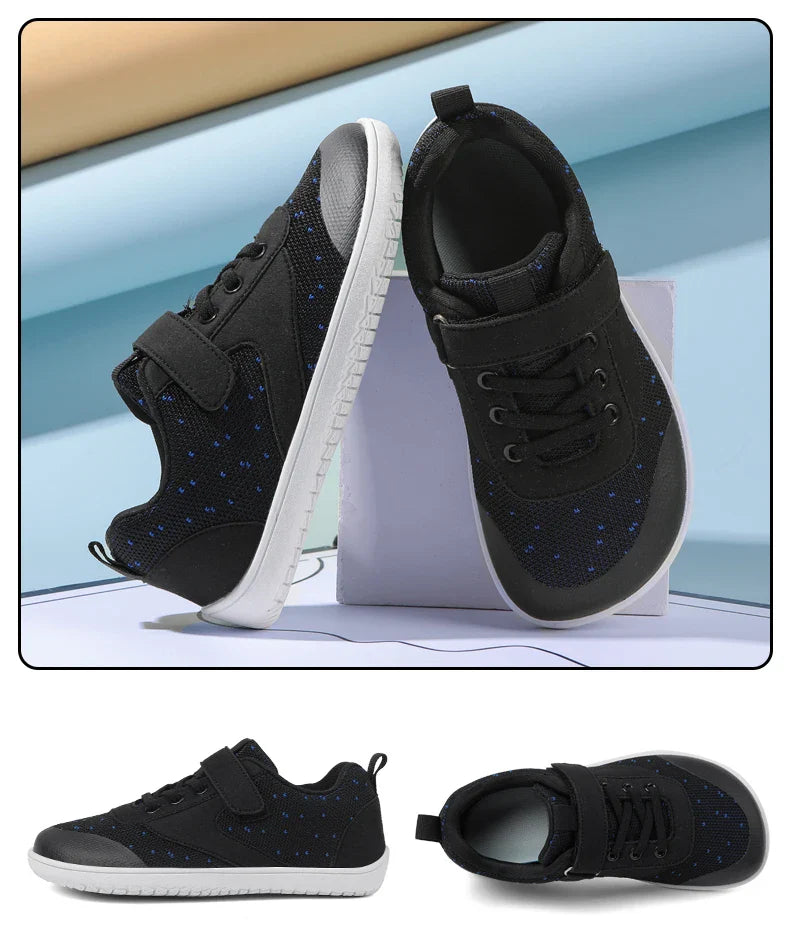 Black kids' sneakers with blue speckles, shown from the side and above