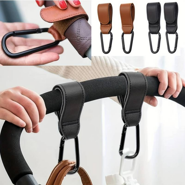 Black stroller hooks attached to a handlebar, with close-ups of the strap and metal clip