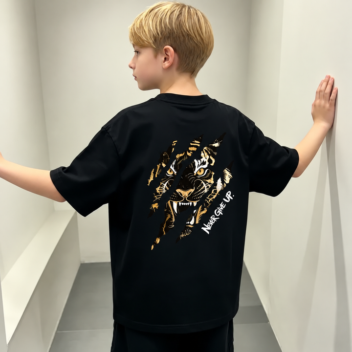 Child wearing the black T-shirt with a large tiger graphic across the back.