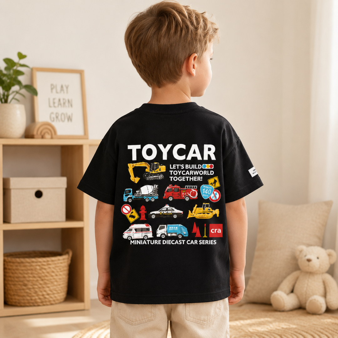 Child wearing a black short-sleeve T-shirt with a large vehicle print on the back