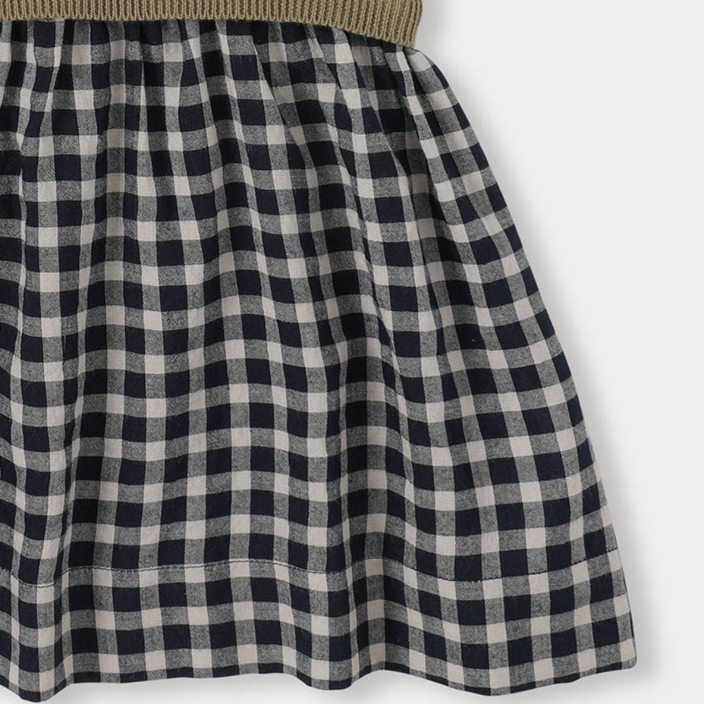 Close-up of the gathered black-and-white checkered cotton skirt.