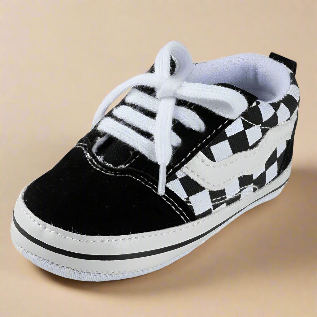 Black-and-white checkered baby sneaker with white laces
