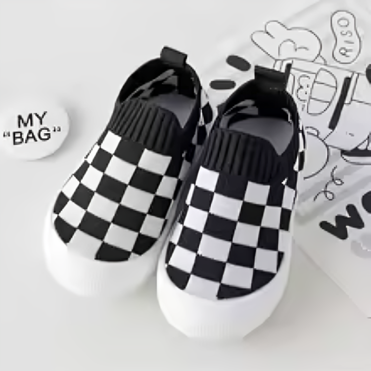Pair of black-and-white checkered slip-on shoes with ribbed black openings