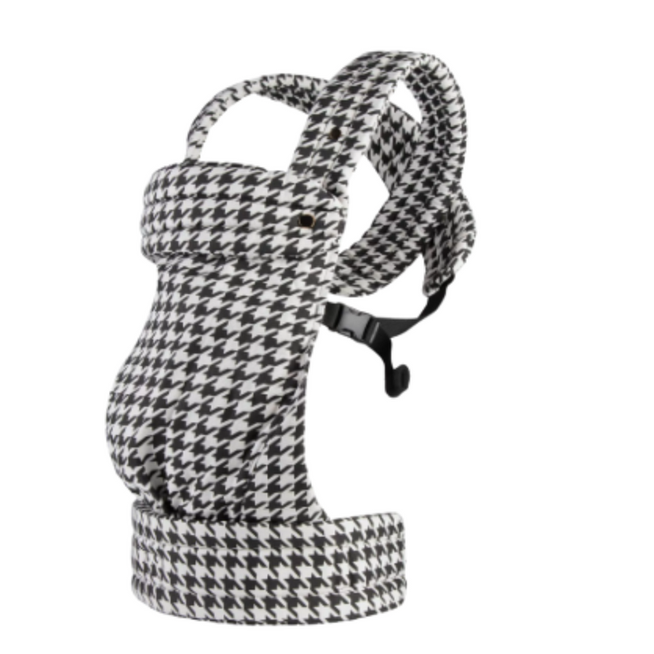 Black-and-white houndstooth baby carrier with padded shoulder straps and waist support