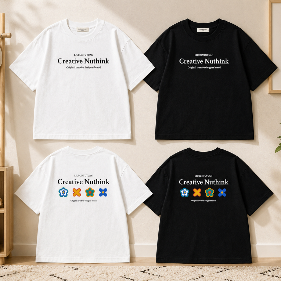 Black and white kids' T-shirts showing front lettering and colorful flower graphics on the back