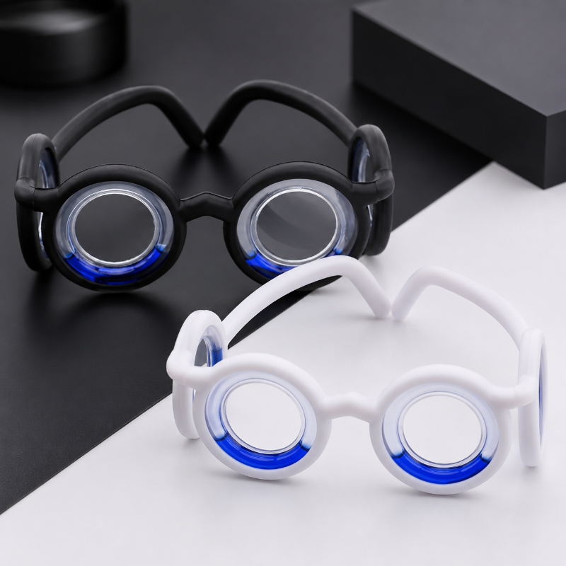 Black and white lens-free travel glasses with blue liquid in the circular frames