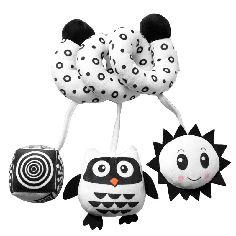 Black-and-white spiral activity toy with a hanging spiral-pattern cube, owl, and sun.