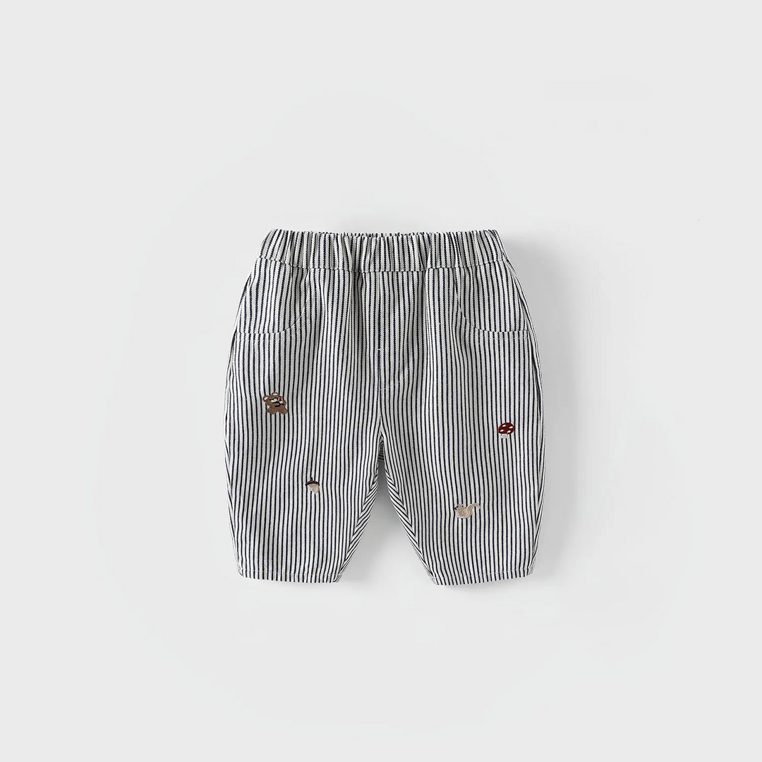 Black-and-white striped pants with an elastic waist and scattered embroidered details.