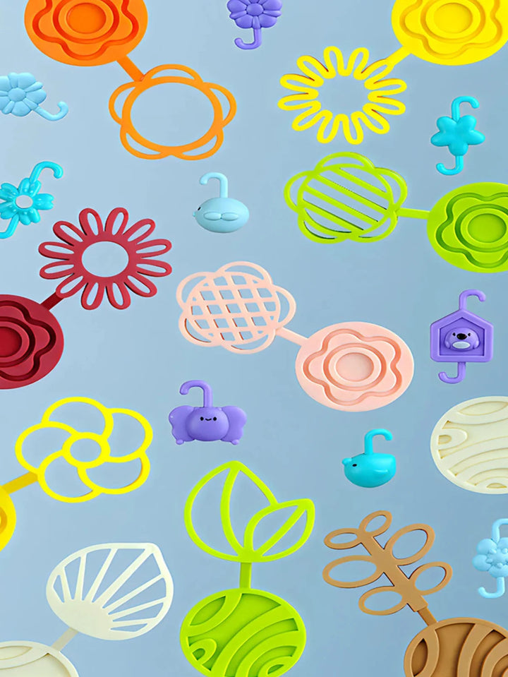 Assorted flower, leaf, bird, and birdhouse shapes against a blue background
