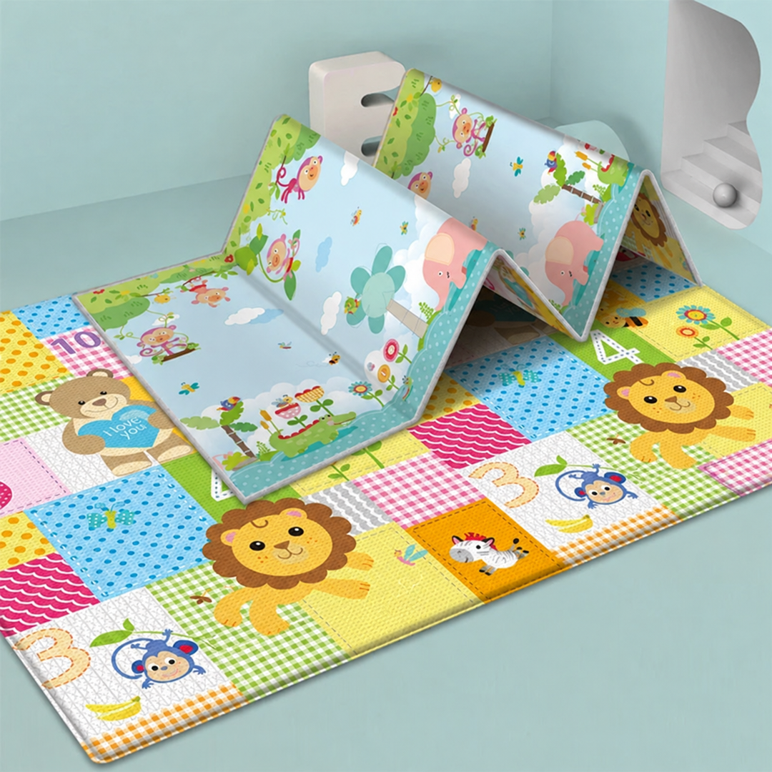 Blue illustrated play mat partly folded above a colorful animal-and-number mat