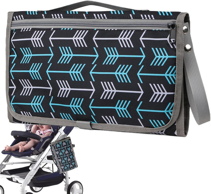 Black changing mat with blue and white arrows, gray trim, and a stroller attachment strap.