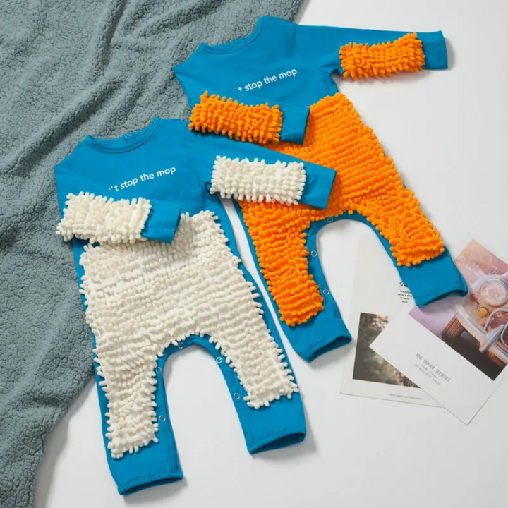 Two blue baby jumpsuits with white and orange cleaning-fiber panels