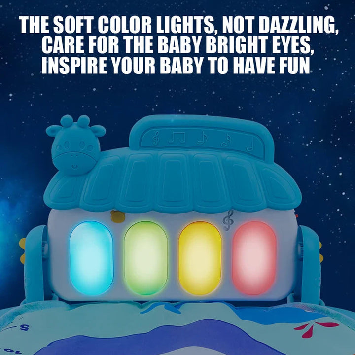 Blue baby gym piano with four illuminated keys against a dark background