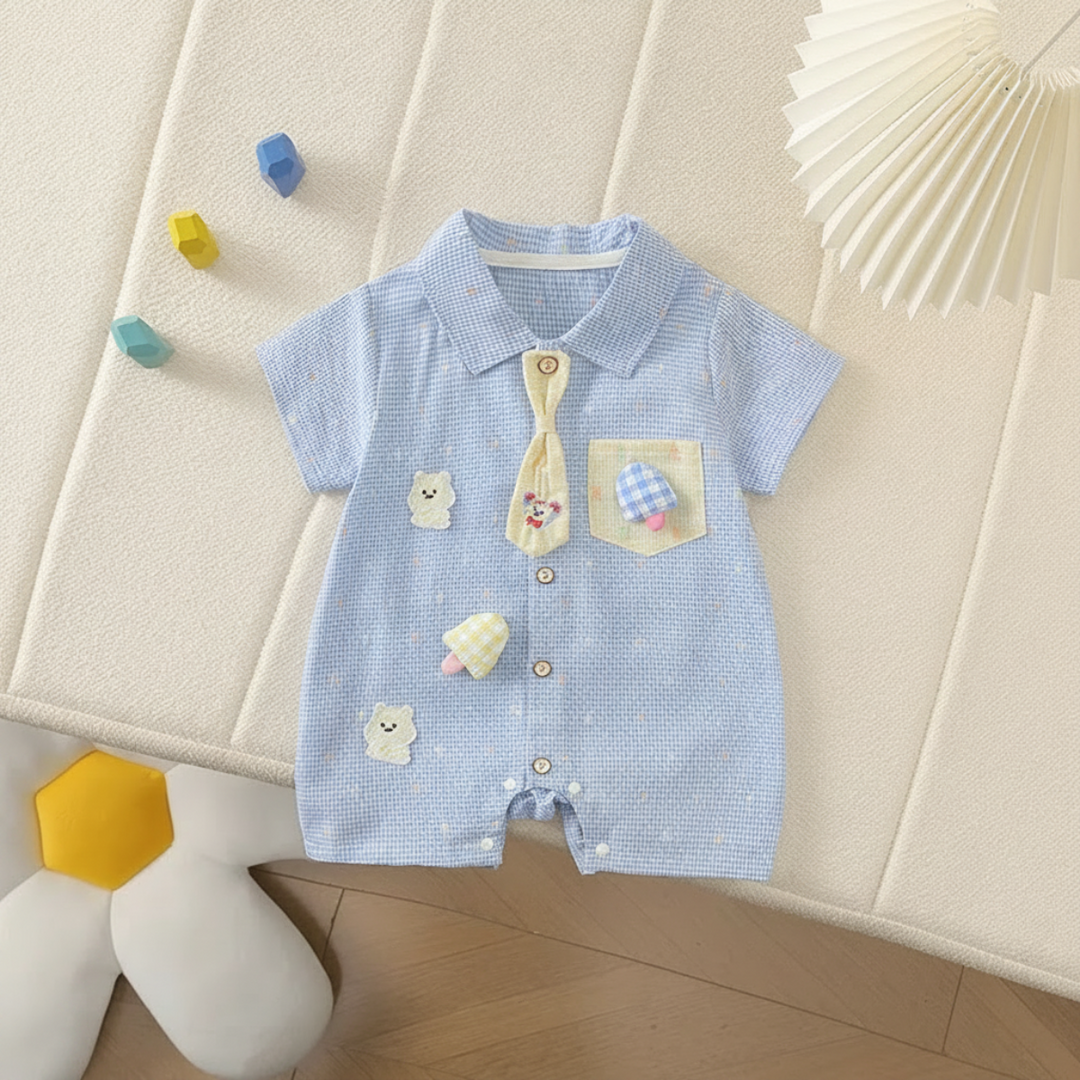 Blue short-sleeve baby romper with a collar, yellow decorative tie, bear details, and mushroom appliqués