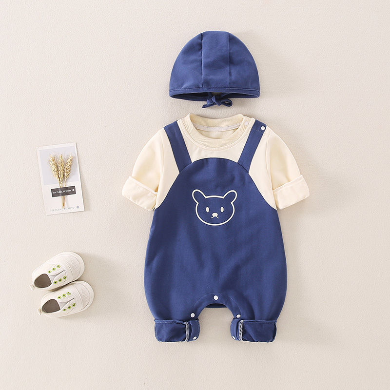 Blue bear-design baby jumpsuit with cream sleeves and a matching hat