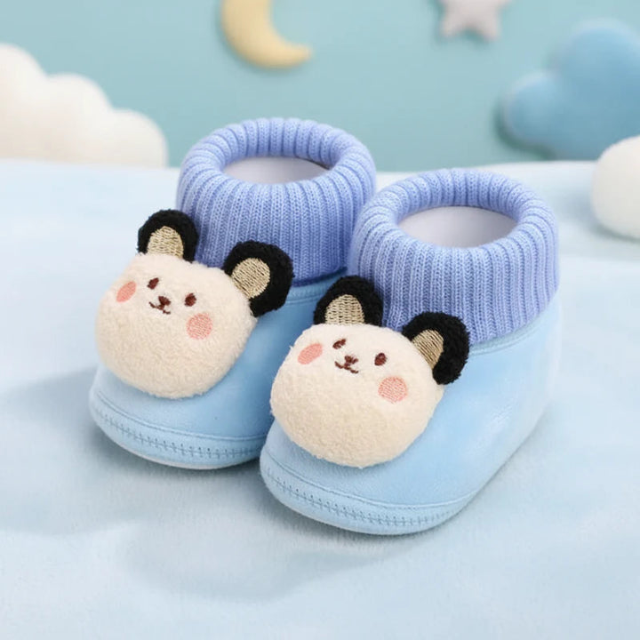 Blue bear baby slippers with cream faces, black ears, and knitted collars