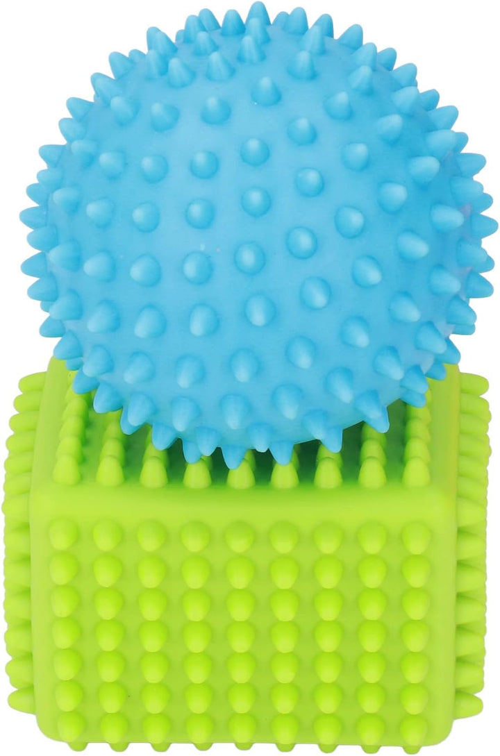 Blue bumpy sensory ball resting on a green textured cube