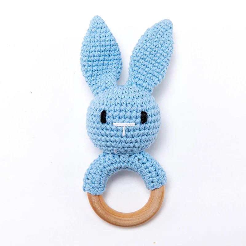 Blue crocheted bunny rattle with long ears and a natural wooden ring