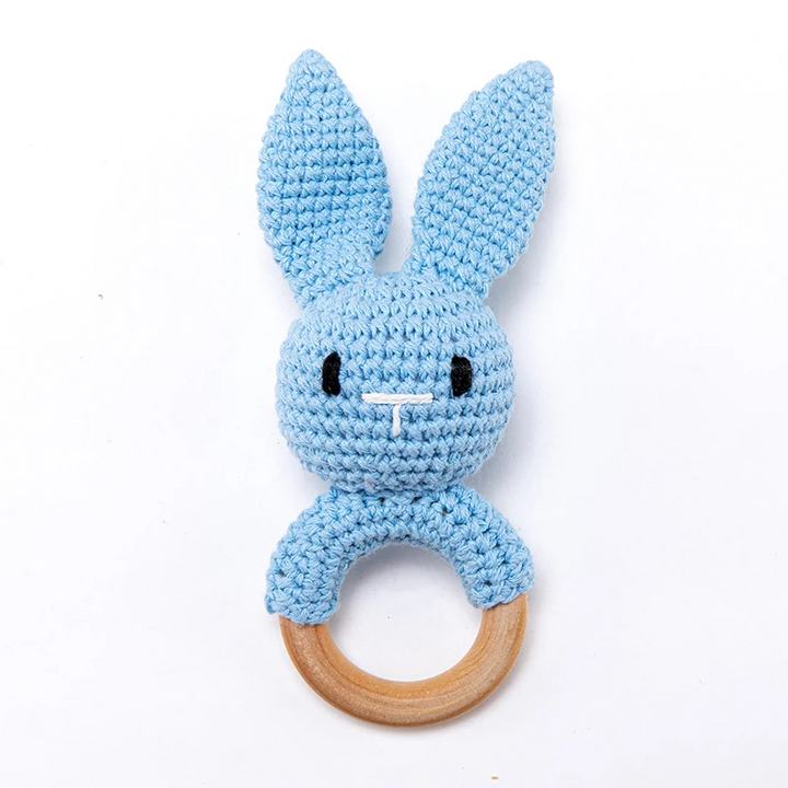 Blue crocheted bunny rattle with long ears and a natural wooden ring