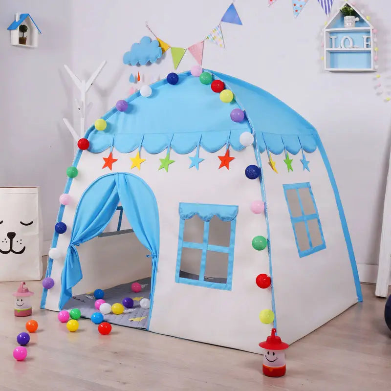 Blue castle play tent decorated with colorful ball lights in a playroom