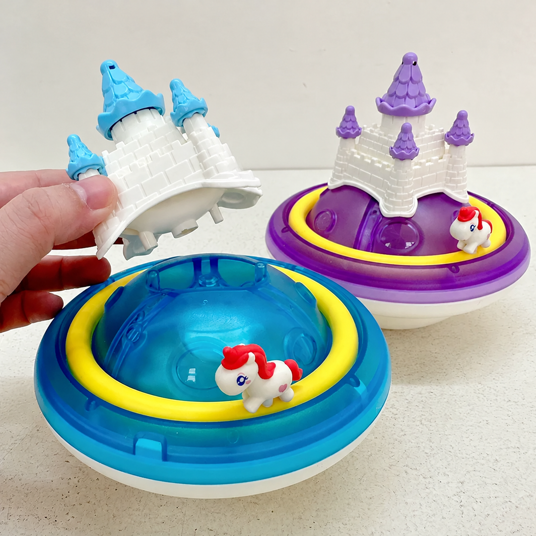 Blue unicorn castle toy with its castle top lifted off beside the assembled purple version